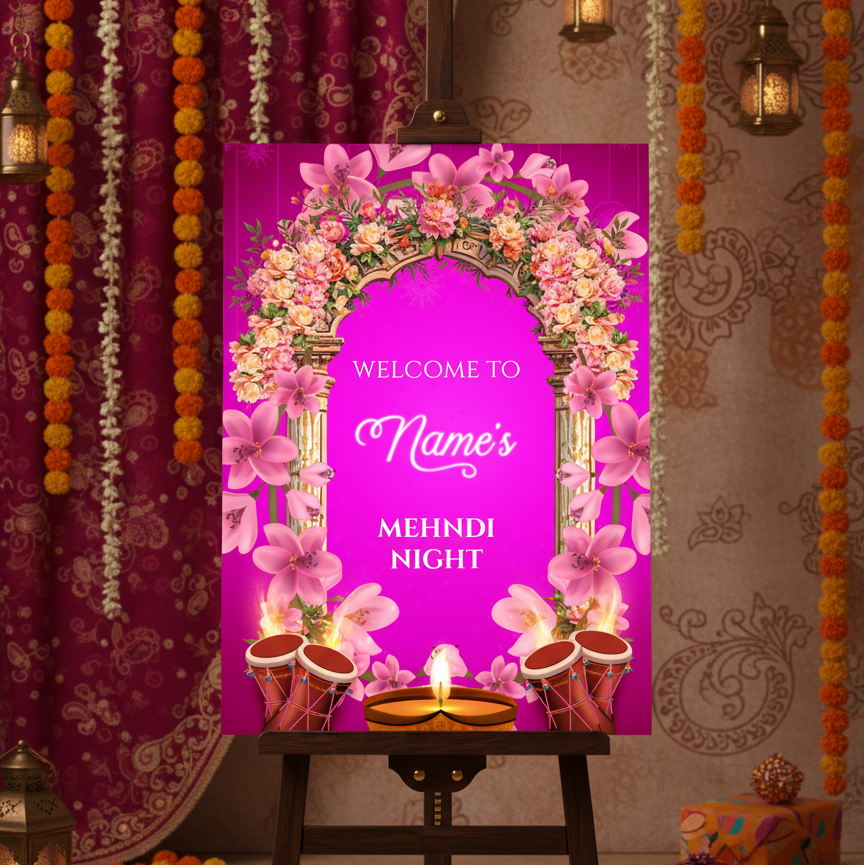 Decorative setup for a Mehndi night with a pink floral arch and candles on an easel.