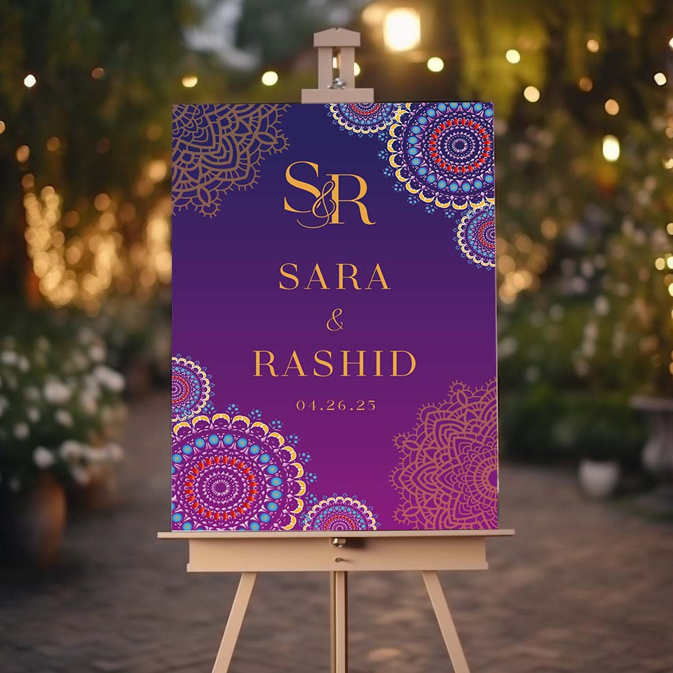 Decorative wedding invitation board on an easel with a blurred festive background